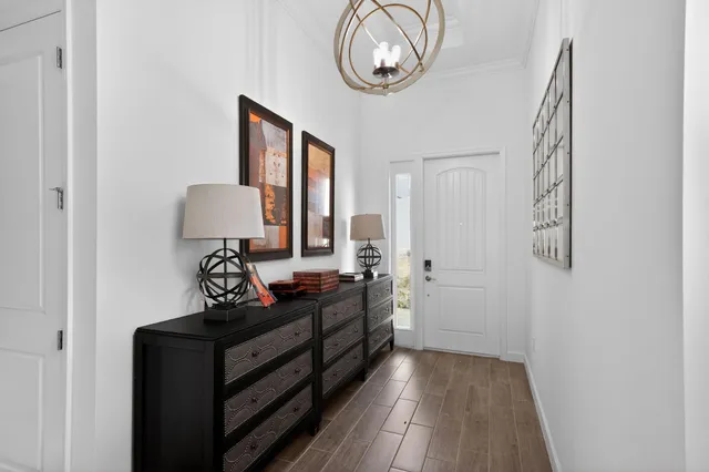 a living room with furniture potted plant and a window
