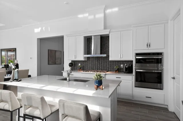 a kitchen with a sink and cabinets