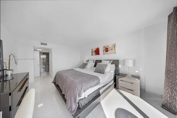 a bedroom with a bed and a cabinets