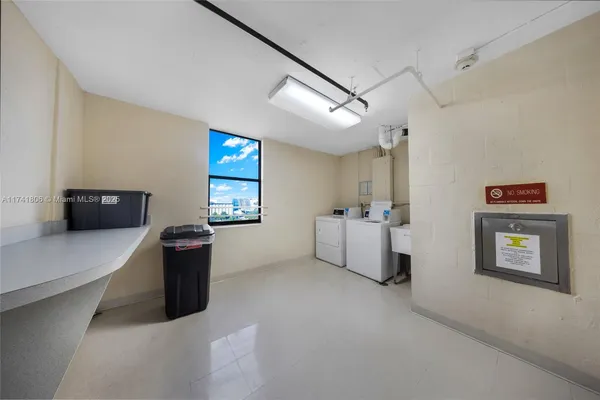 a view of workspace with furniture and window