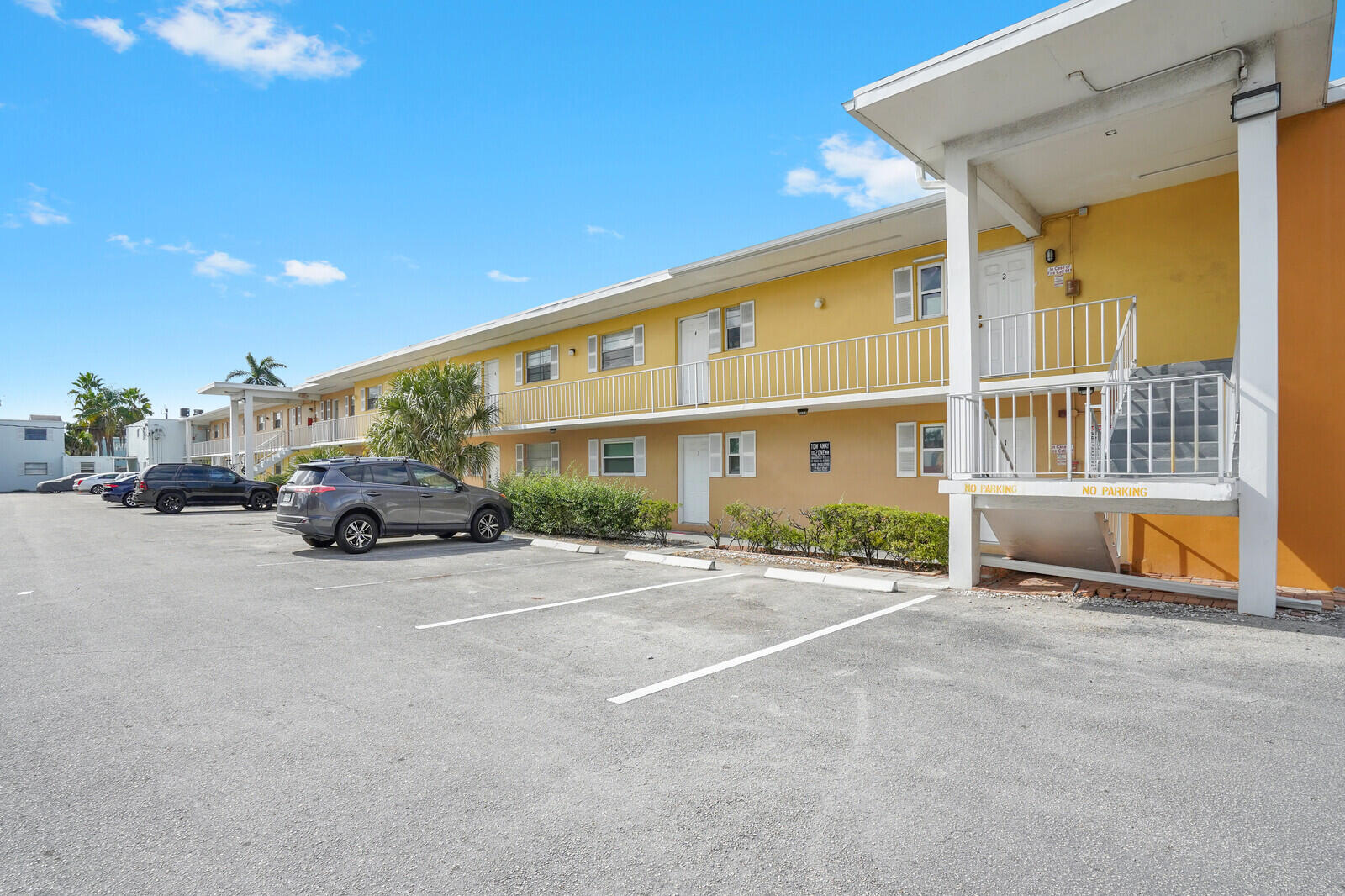 1505 Crescent Circle, Unit A11 Lake Park, FL 33403 - Photo 1 of 14 a view of a car park in front of a building