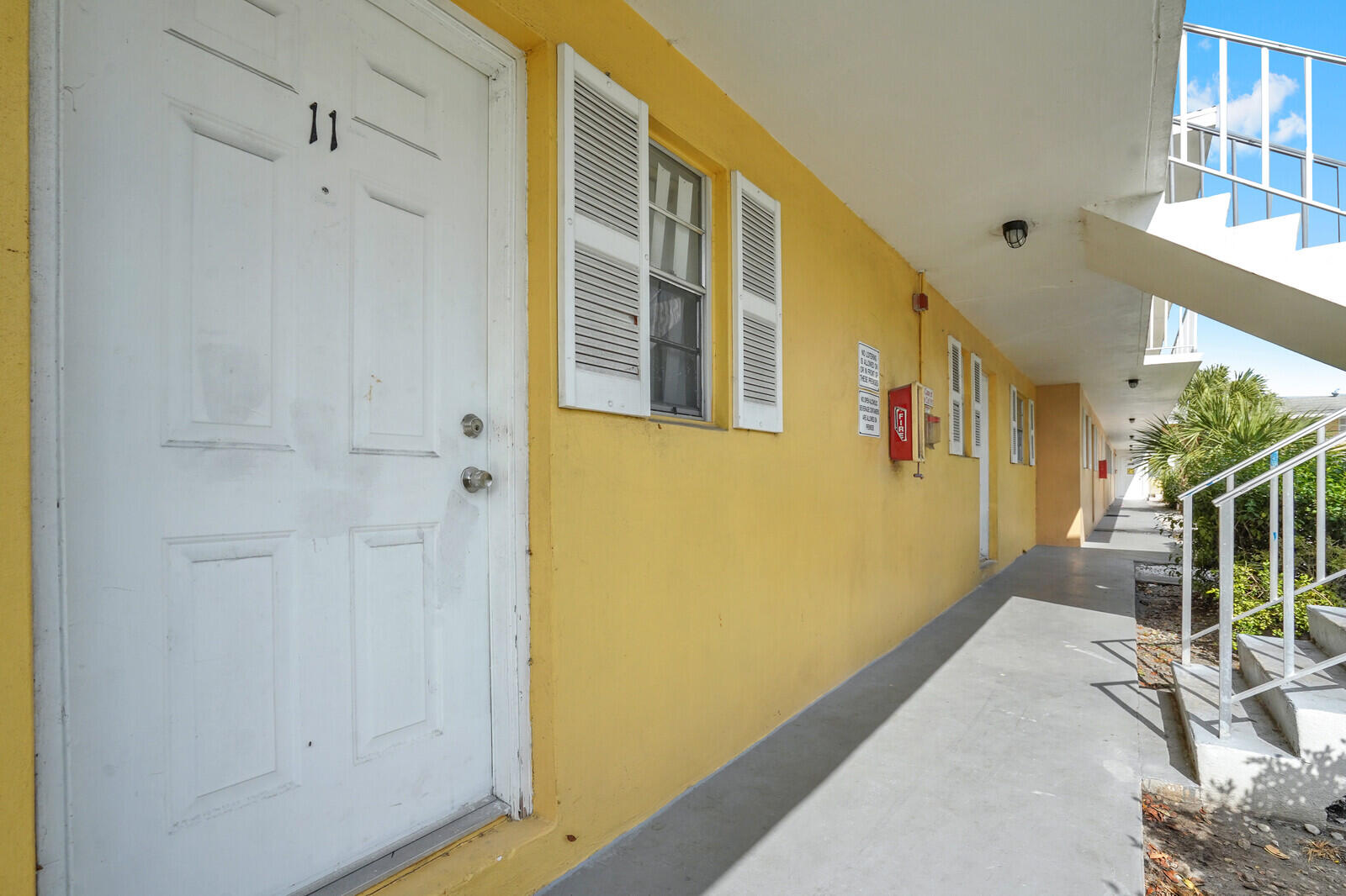 1505 Crescent Circle, Unit A11 Lake Park, FL 33403 - Photo 11 of 14 a view of a hallway with wooden floor and entryway