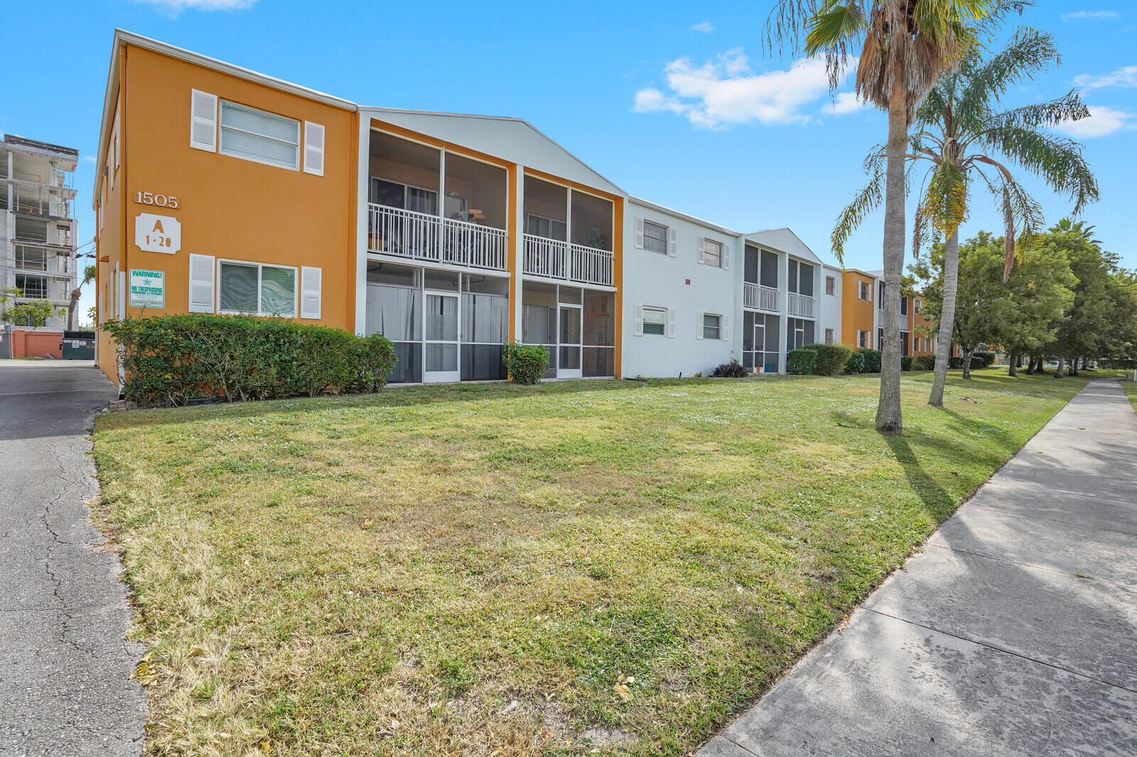 1505 Crescent Circle, Unit A11 Lake Park, FL 33403 - Photo 13 of 14 a view of a building with a yard