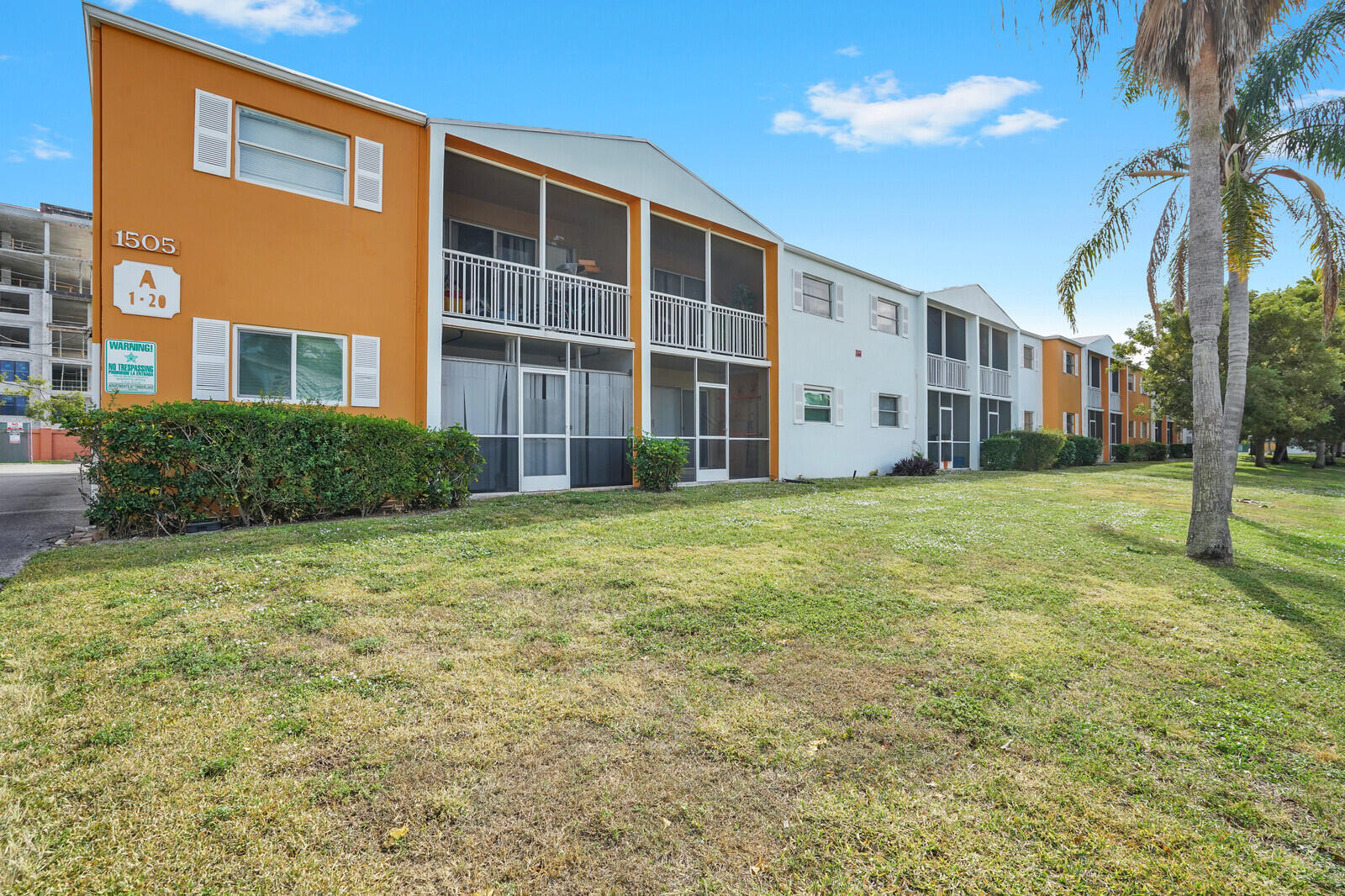 1505 Crescent Circle, Unit A11 Lake Park, FL 33403 - Photo 14 of 14 a view of a building with a yard