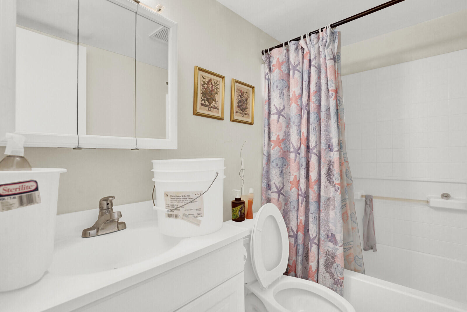 1505 Crescent Circle, Unit A11 Lake Park, FL 33403 - Photo 9 of 14 a bathroom with a sink toilet and shower