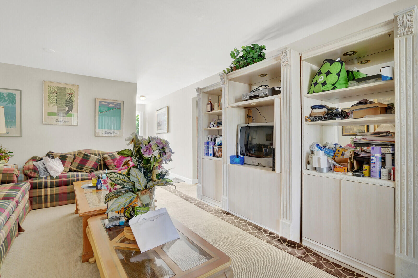 1505 Crescent Circle, Unit A11 Lake Park, FL 33403 - Photo 10 of 14 a living room with furniture and a potted plant