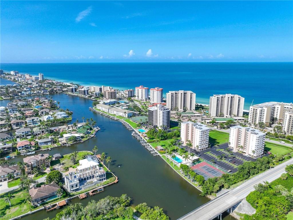 5 Bluebill Avenue, Unit 108 Naples, FL 34108 - Photo 30 of 49 Aerial view of a large body of water