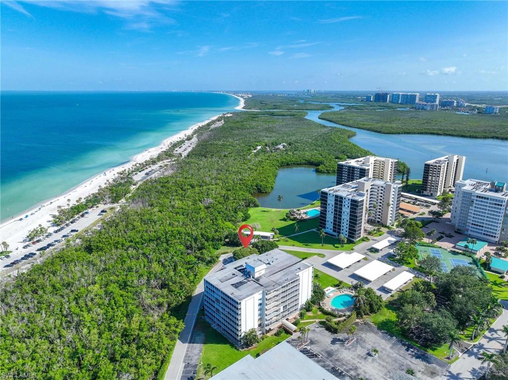 5 Bluebill Avenue, Unit 108 Naples, FL 34108 - Photo 31 of 49 Aerial view of unending shoreline
