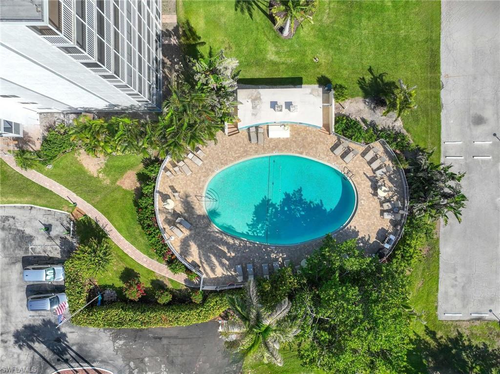 5 Bluebill Avenue, Unit 108 Naples, FL 34108 - Photo 39 of 49 Aerial view of a pool area