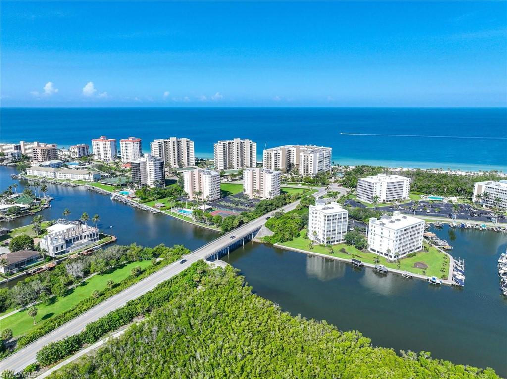 5 Bluebill Avenue, Unit 108 Naples, FL 34108 - Photo 43 of 49 Bird's eye view of a large body of water