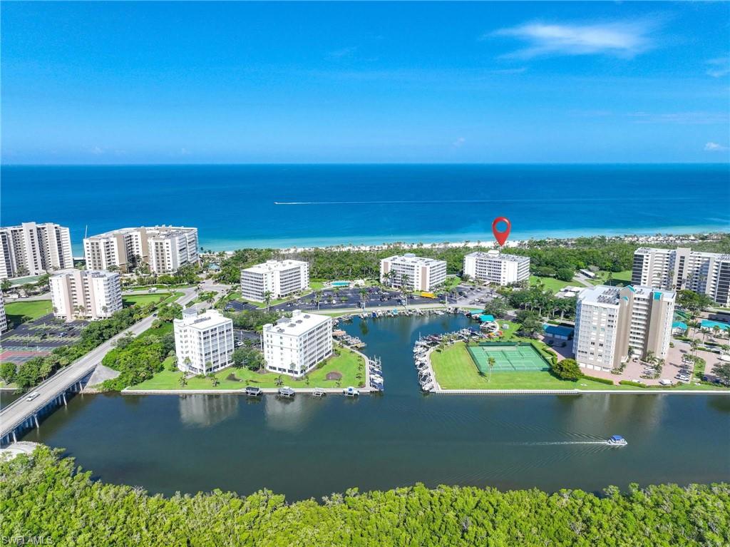 5 Bluebill Avenue, Unit 108 Naples, FL 34108 - Photo 46 of 49 Drone / aerial view of a large body of water