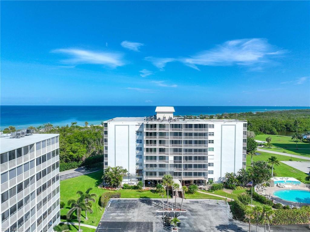 5 Bluebill Avenue, Unit 108 Naples, FL 34108 - Photo 49 of 49 View of apartment building / complex featuring a water view