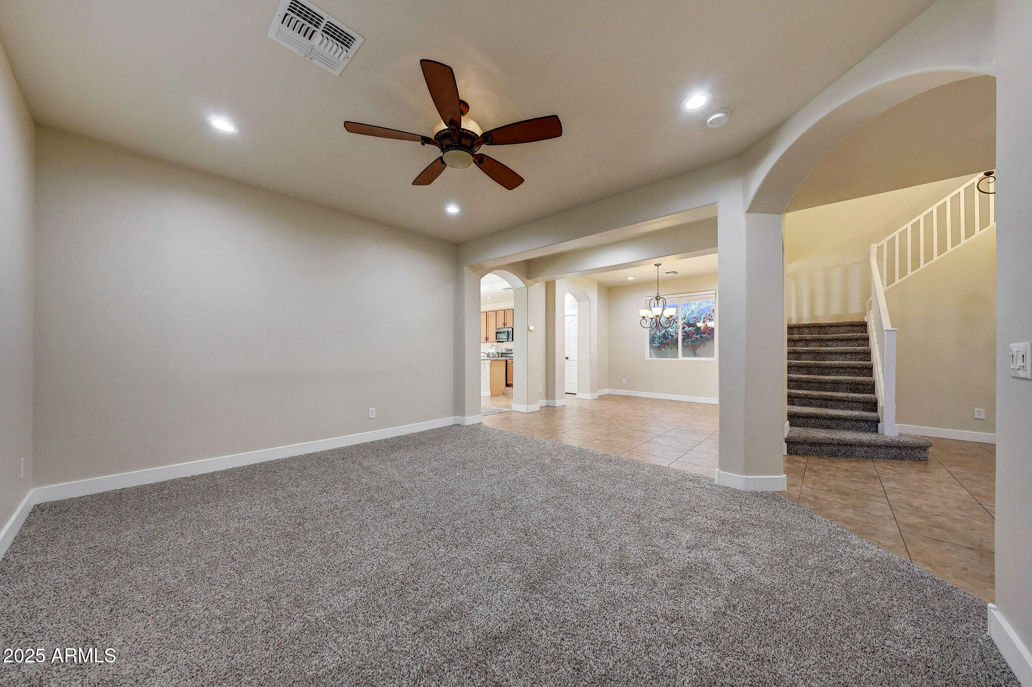 20719 West Hamilton Street Buckeye, AZ 85396 - Photo 12 of 100 a view of a livingroom with a ceiling fan and window