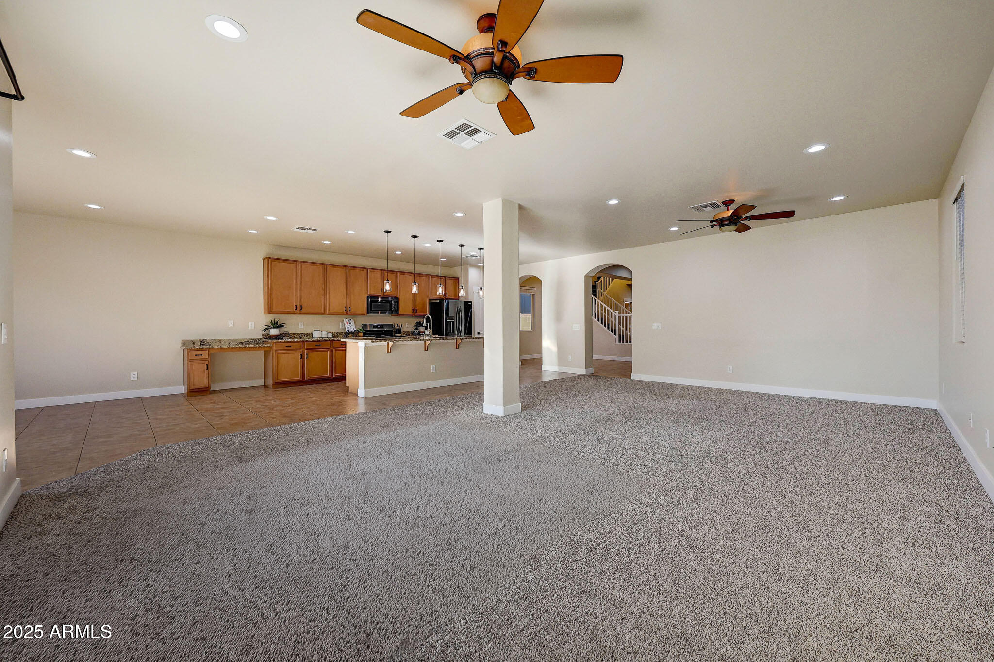 20719 West Hamilton Street Buckeye, AZ 85396 - Photo 16 of 100 a view of a livingroom with furniture and a ceiling fan