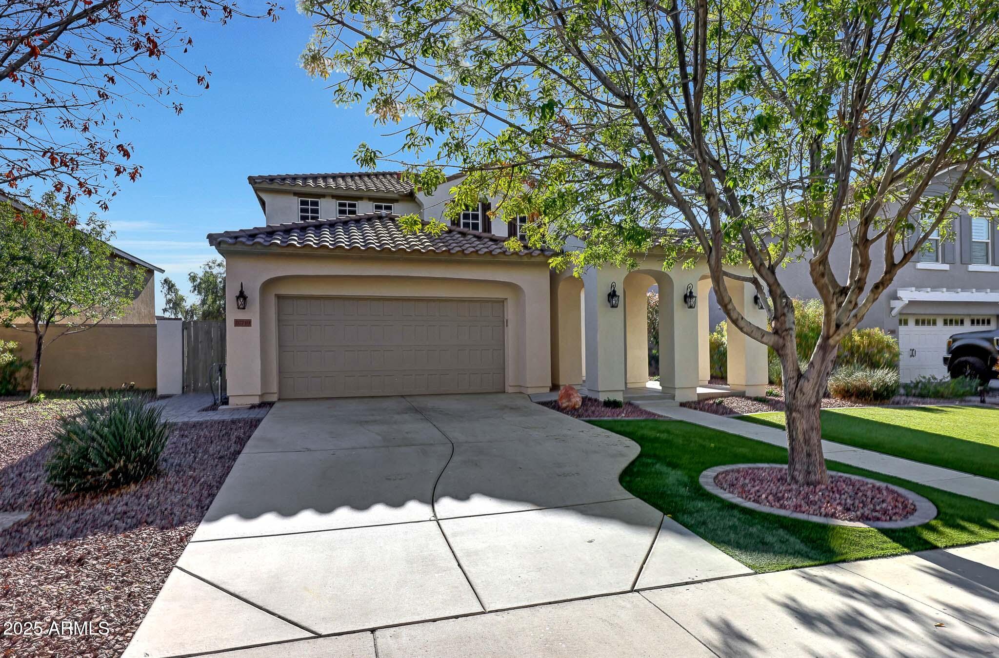 20719 West Hamilton Street Buckeye, AZ 85396 - Photo 2 of 100 a front view of a house with garden