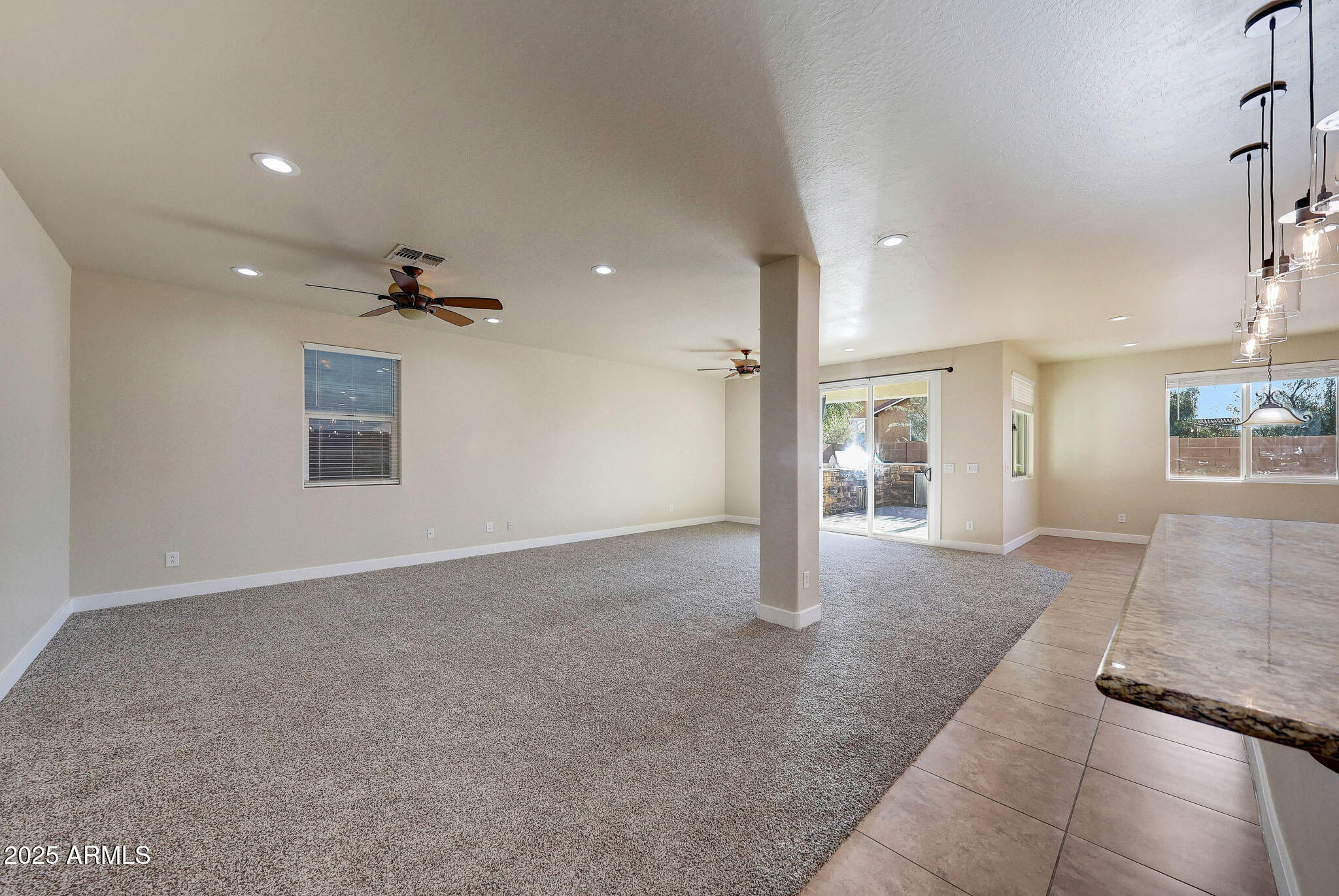 20719 West Hamilton Street Buckeye, AZ 85396 - Photo 23 of 100 a view of livingroom with hardwood floor and a ceiling fan