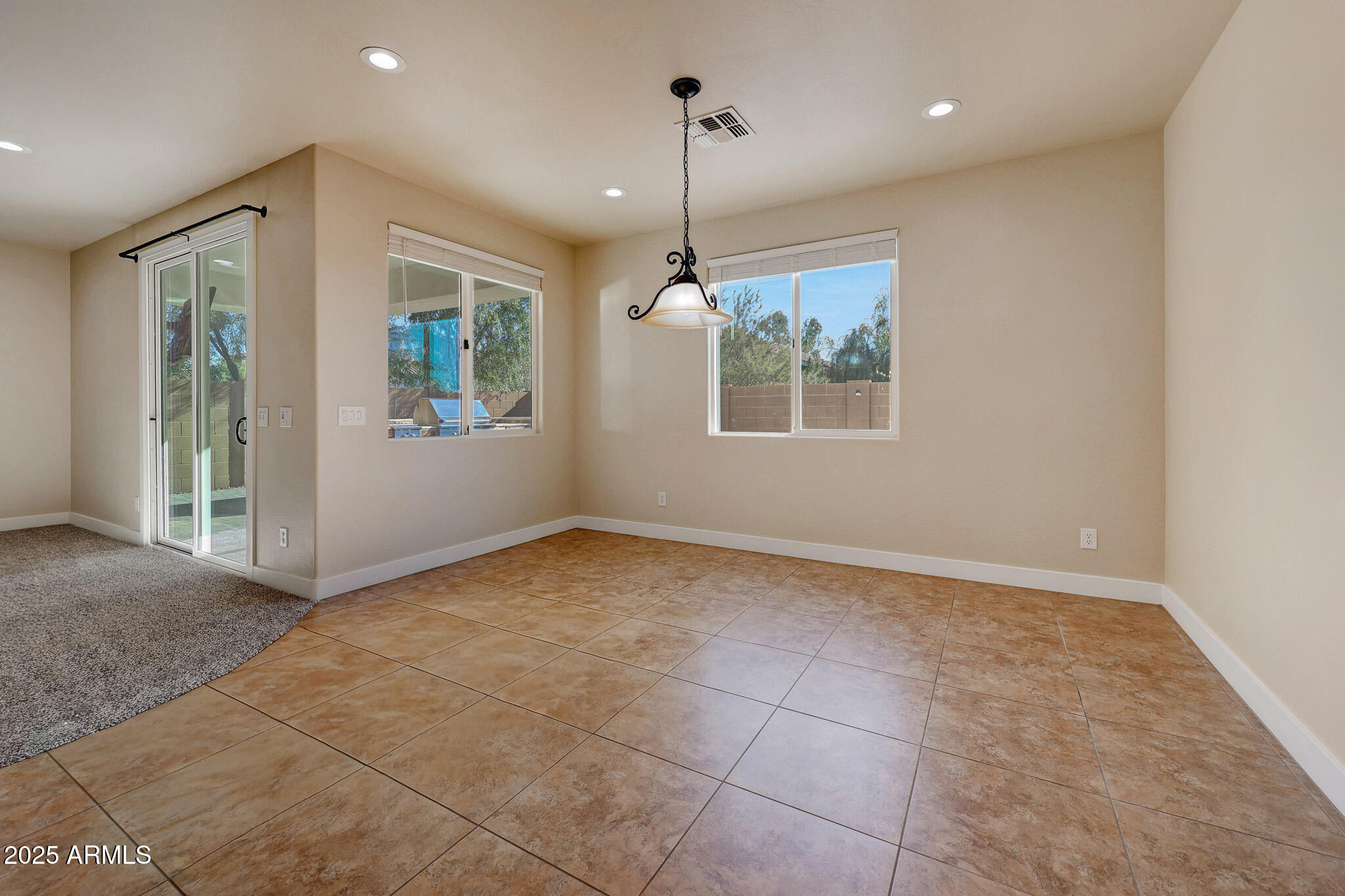 20719 West Hamilton Street Buckeye, AZ 85396 - Photo 28 of 100 a view of an empty room with a window