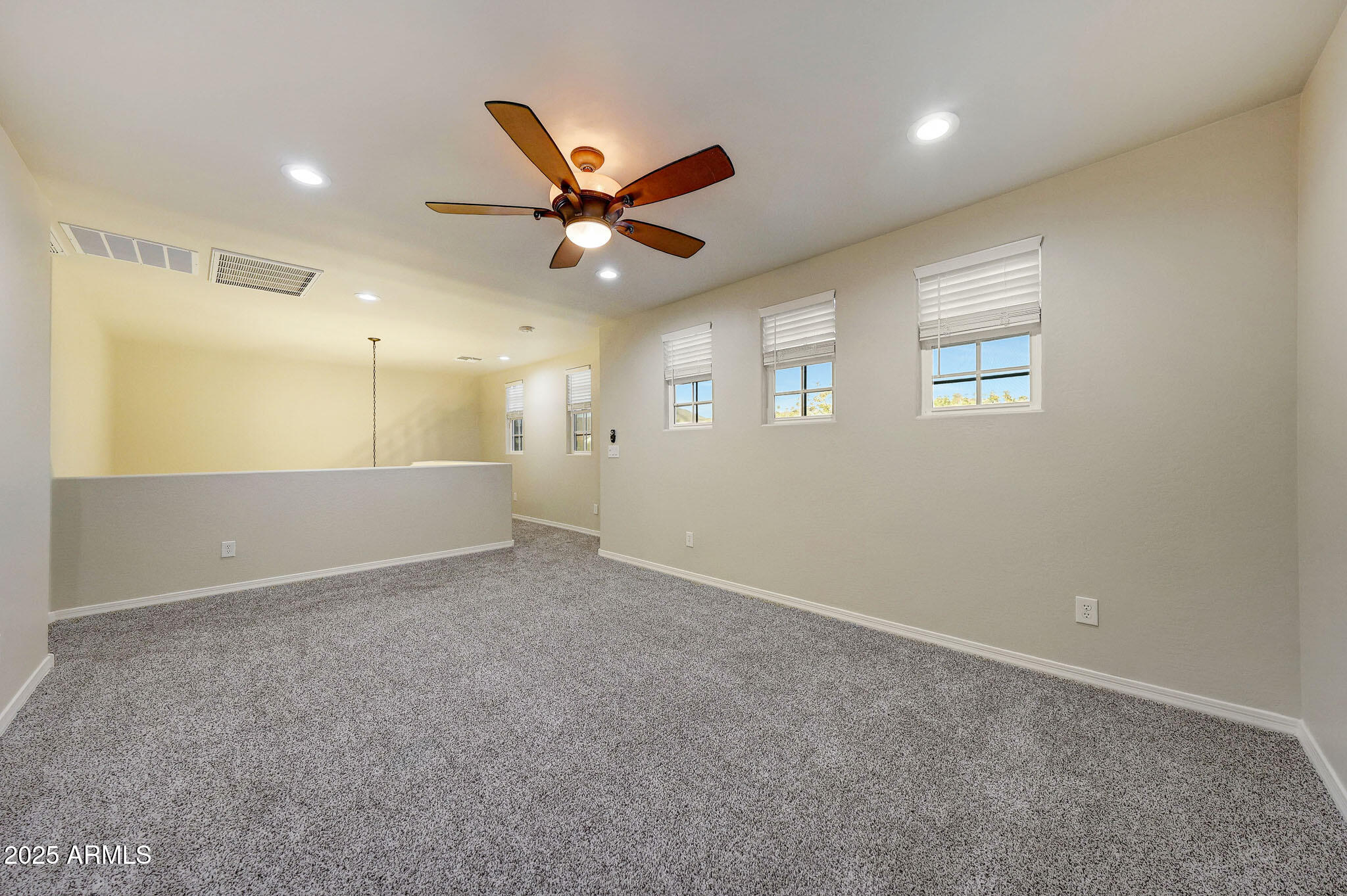 20719 West Hamilton Street Buckeye, AZ 85396 - Photo 30 of 100 a view of an empty room with a ceiling fan