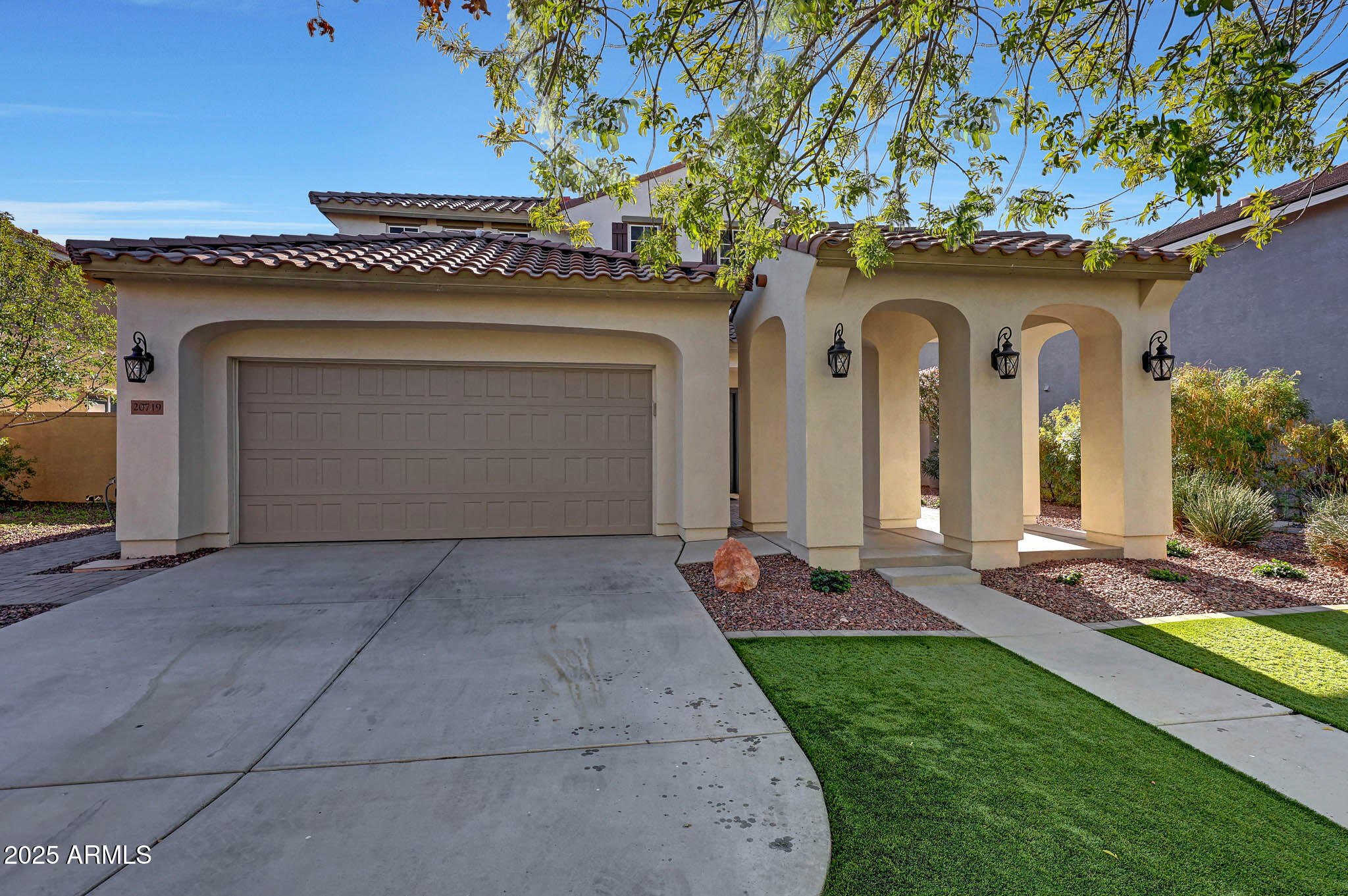 20719 West Hamilton Street Buckeye, AZ 85396 - Photo 3 of 100 a front view of a house with garden