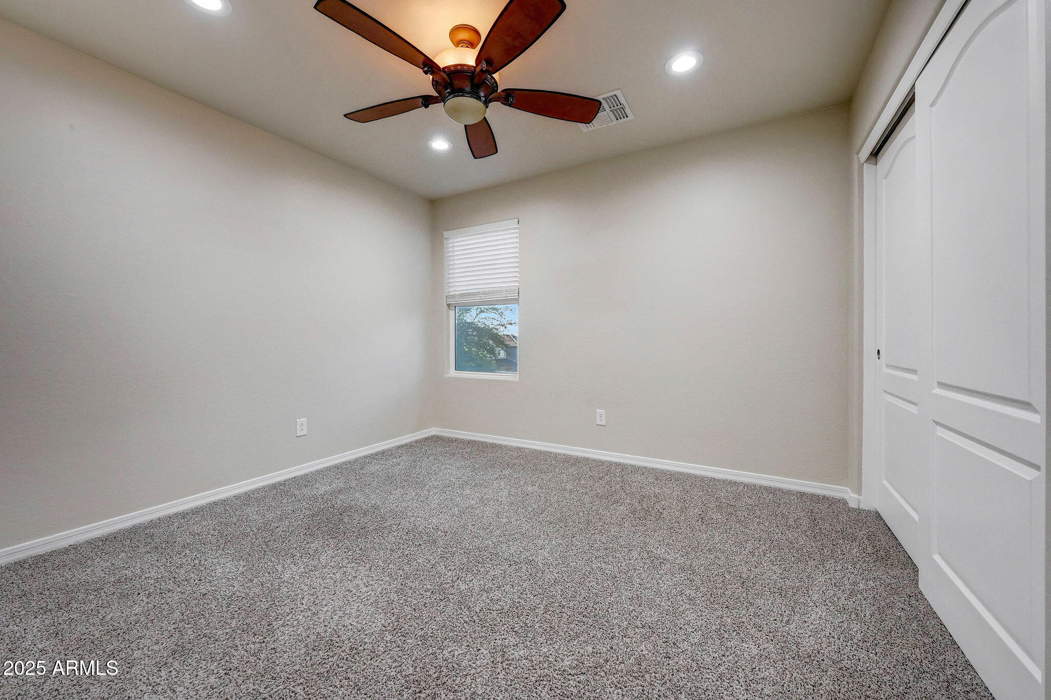 20719 West Hamilton Street Buckeye, AZ 85396 - Photo 34 of 100 an empty room with a window and a fan