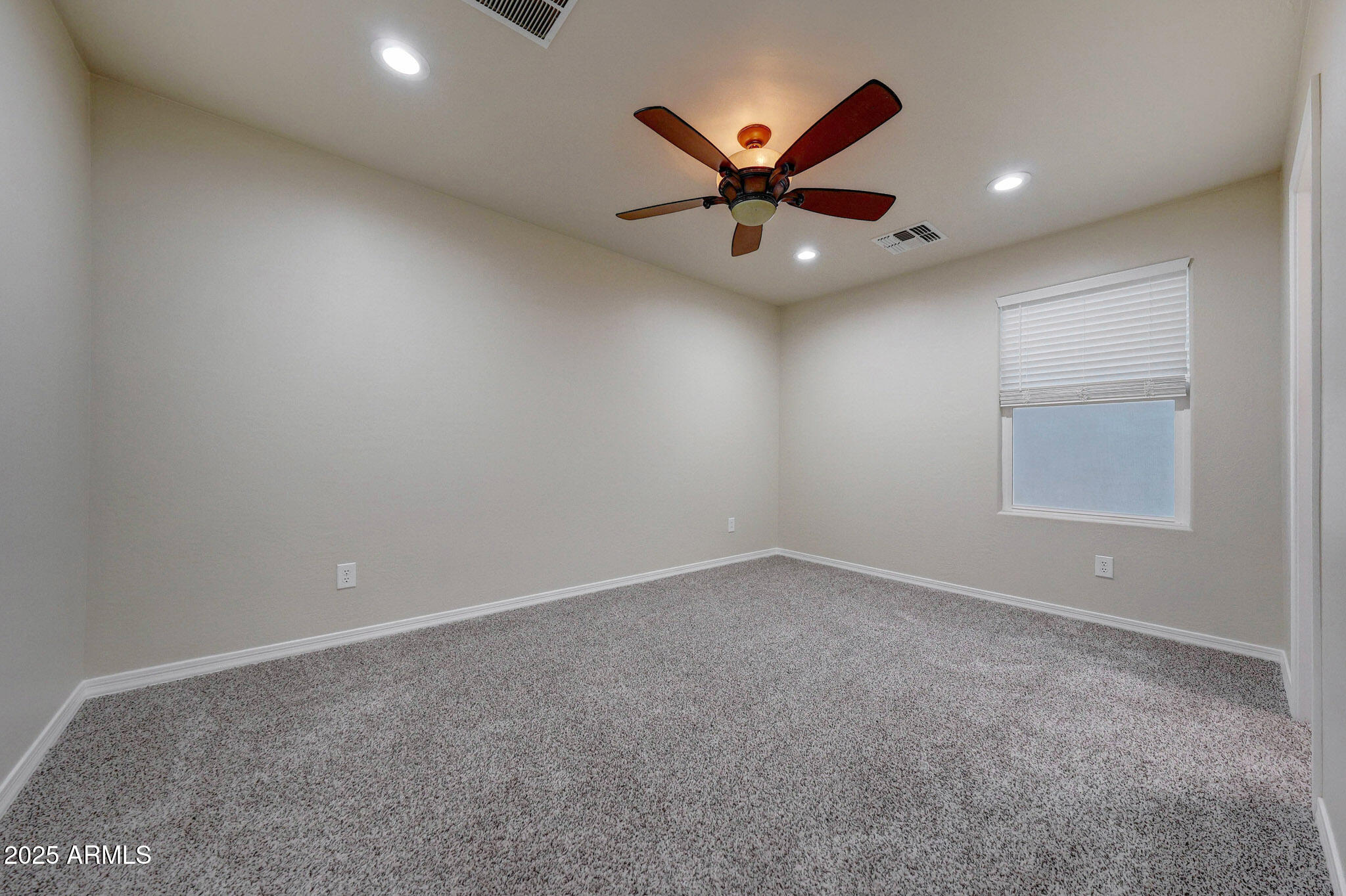 20719 West Hamilton Street Buckeye, AZ 85396 - Photo 39 of 100 an empty room with windows and fan