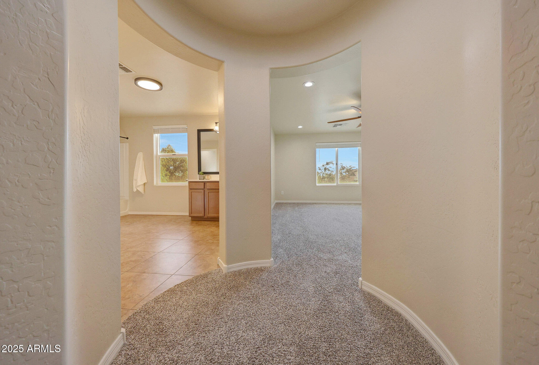20719 West Hamilton Street Buckeye, AZ 85396 - Photo 42 of 100 an empty room with windows and kitchen view