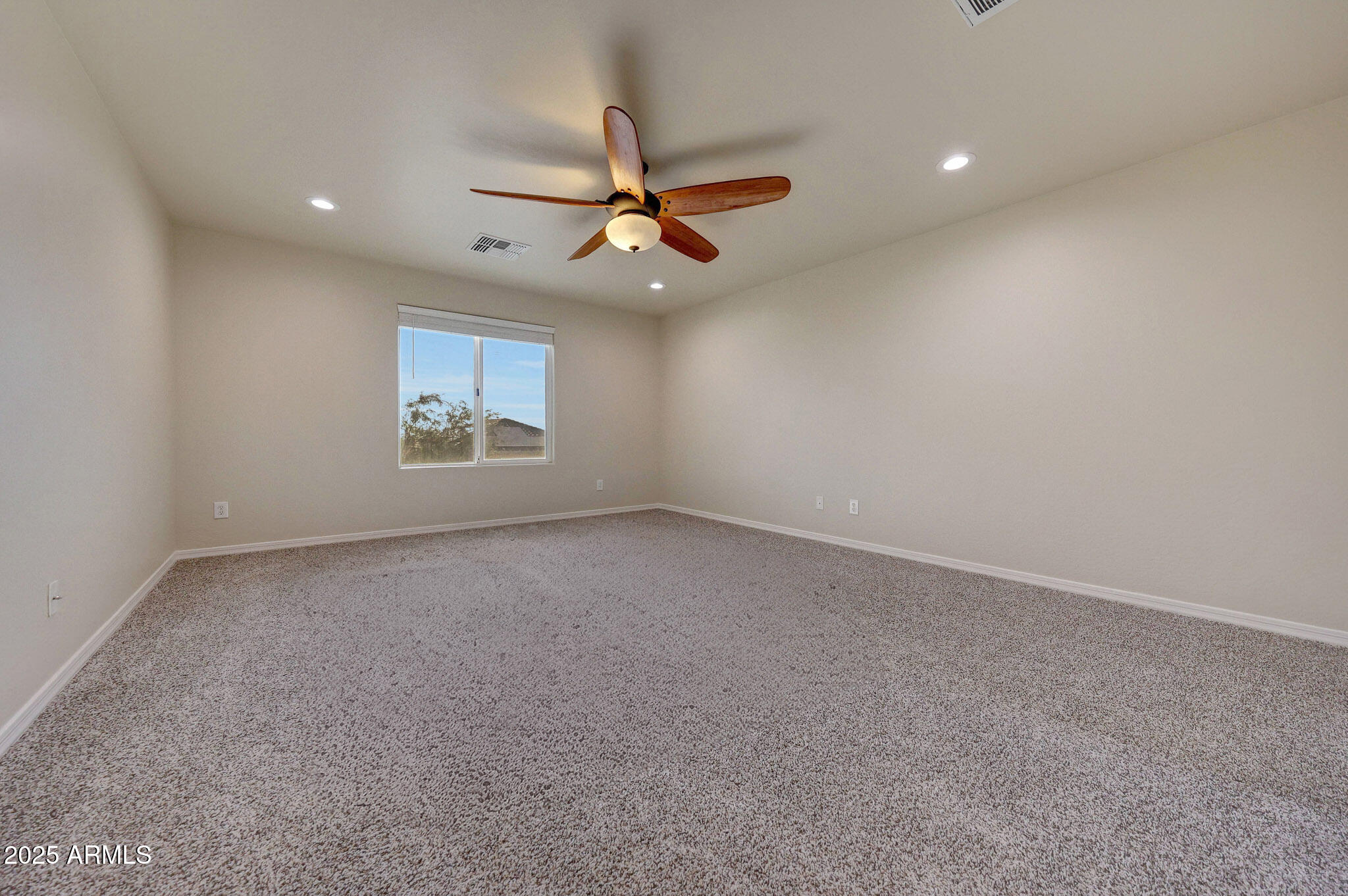 20719 West Hamilton Street Buckeye, AZ 85396 - Photo 43 of 100 an empty room with windows and fan