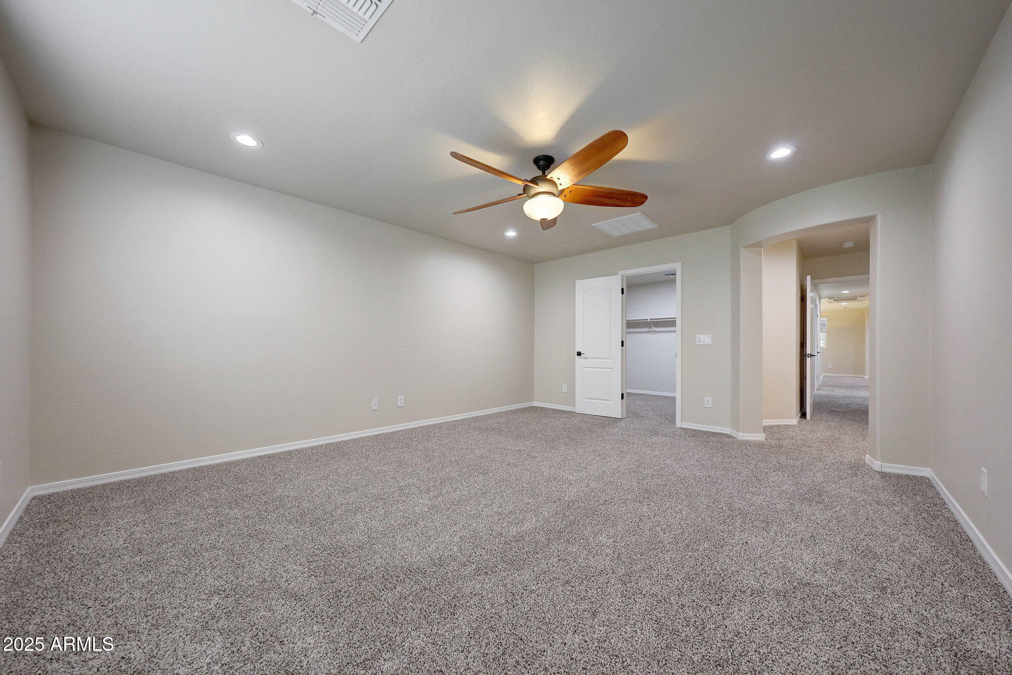 20719 West Hamilton Street Buckeye, AZ 85396 - Photo 45 of 100 a view of an empty room with a ceiling fan