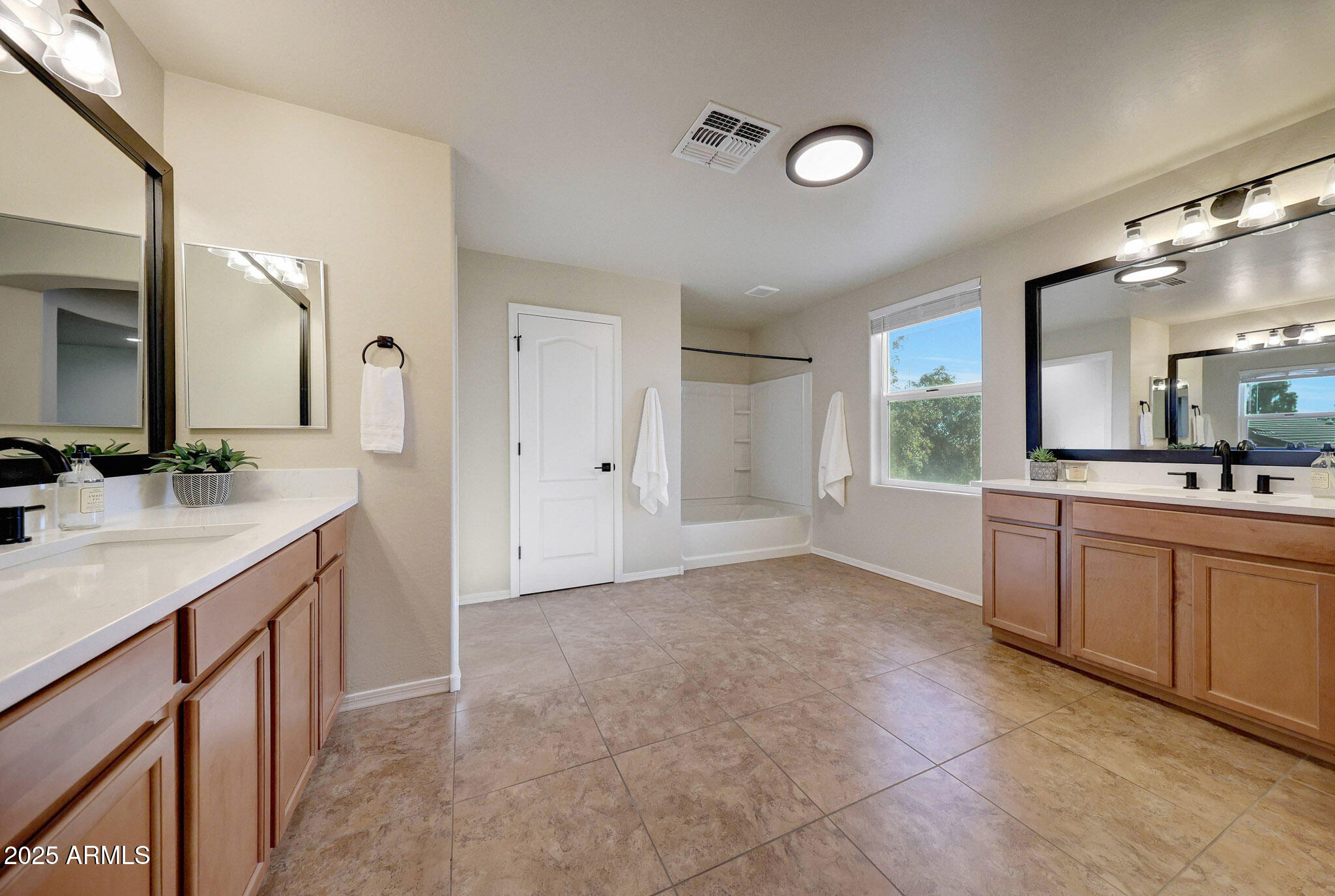 20719 West Hamilton Street Buckeye, AZ 85396 - Photo 48 of 100 a bathroom with a double vanity sink and mirror