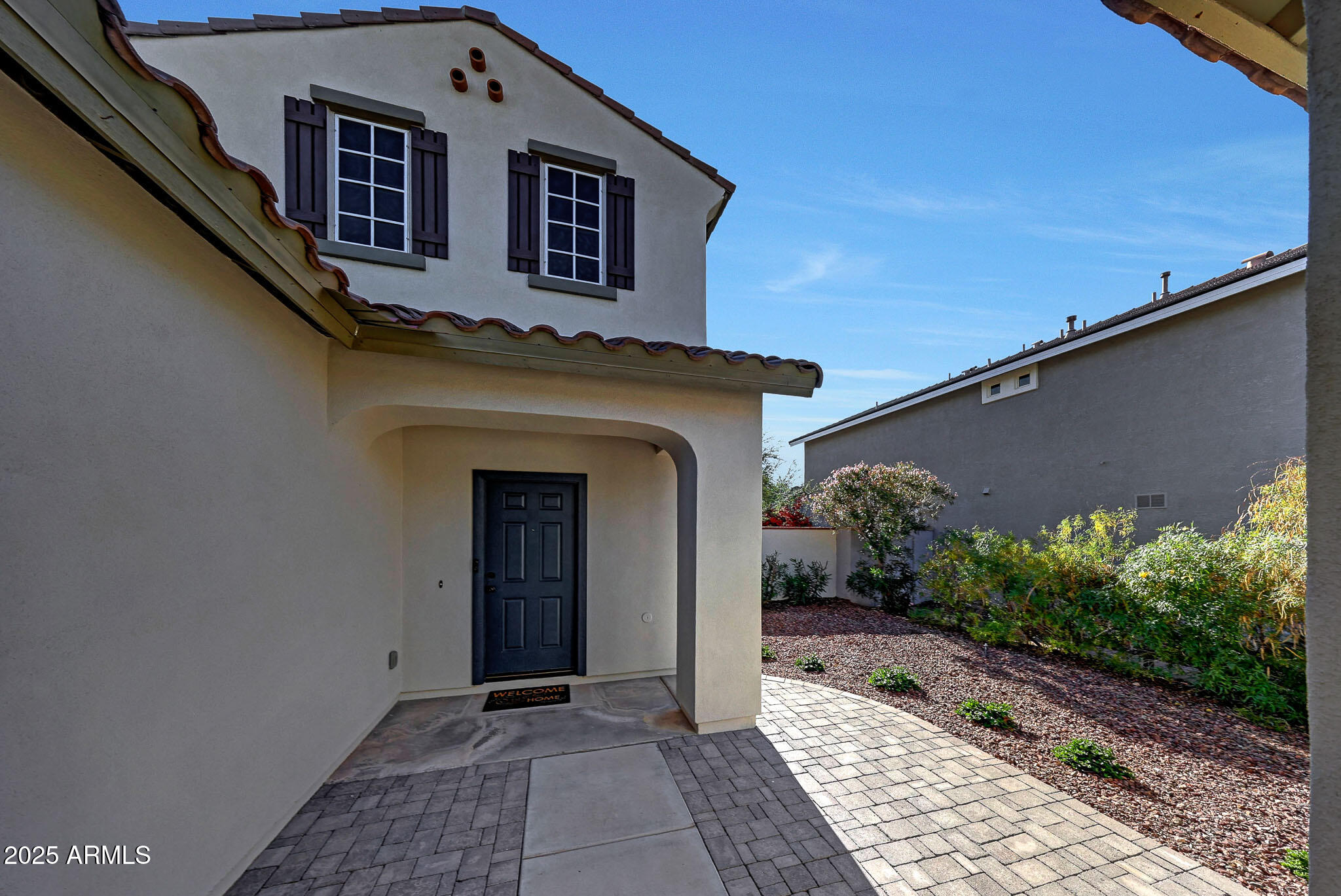 20719 West Hamilton Street Buckeye, AZ 85396 - Photo 5 of 100 a front view of a house with garden
