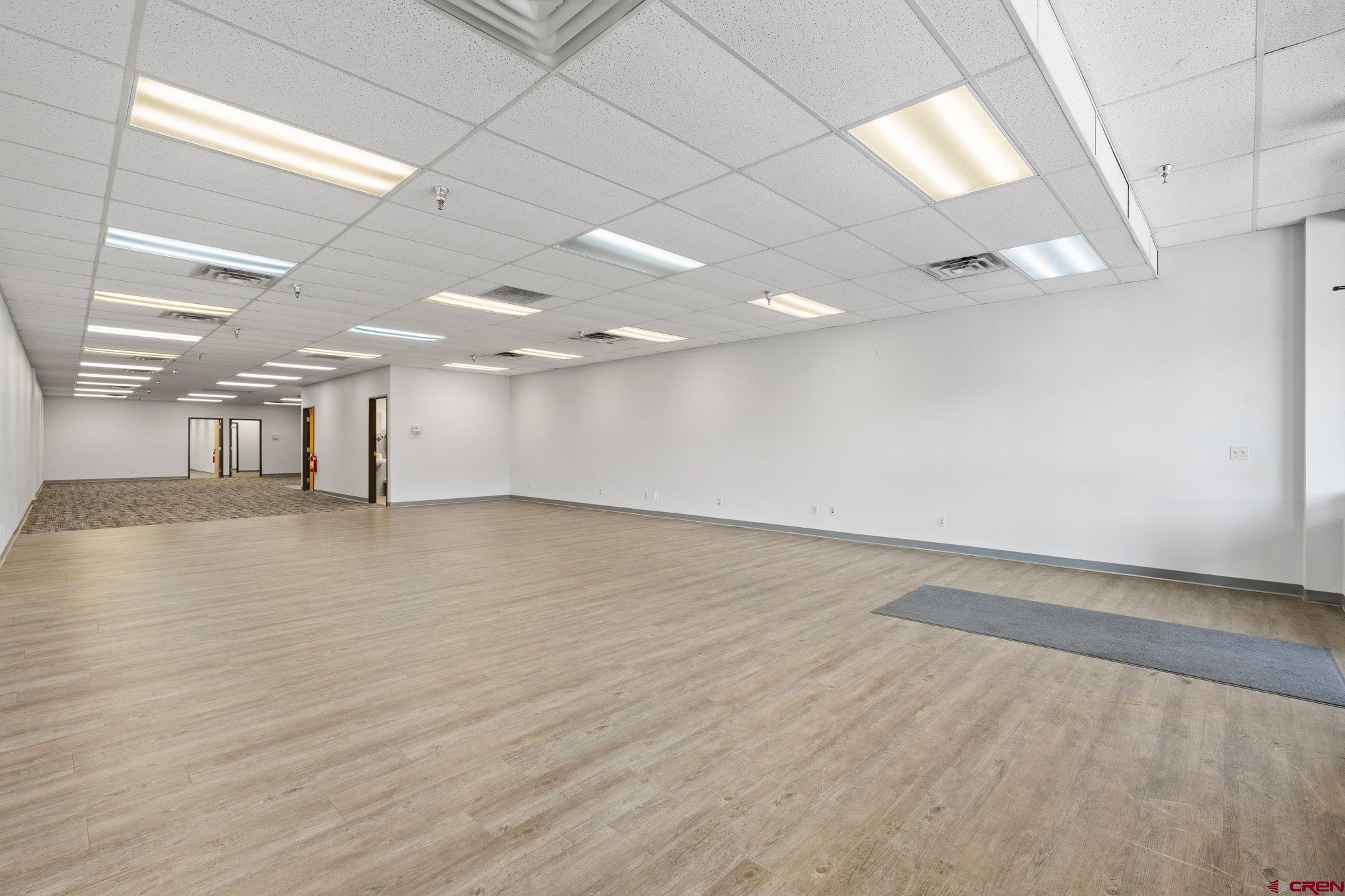 329 South Camino Del Rio Durango, CO 81303 - Photo 3 of 29 an empty room with wooden floor