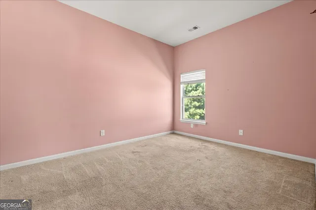 a view of an empty room with window