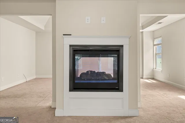 a white building with a fireplace
