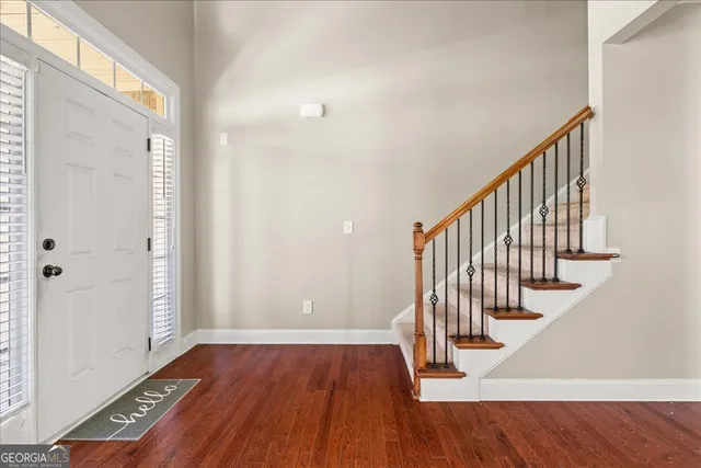 a view of entryway with wooden floor