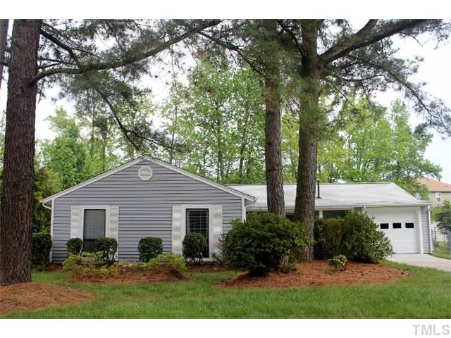 5412 Round Hill Lane Raleigh, NC 27616 - Photo 1 of 19 a view of a yard in front of a house with large windows