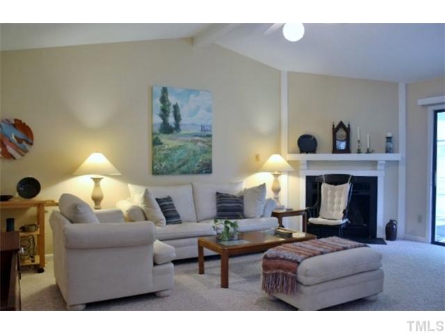 5412 Round Hill Lane Raleigh, NC 27616 - Photo 2 of 19 a living room with furniture and a fireplace