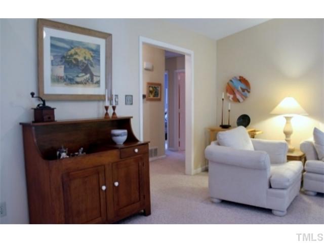 5412 Round Hill Lane Raleigh, NC 27616 - Photo 3 of 19 a living room with furniture and a flat screen tv