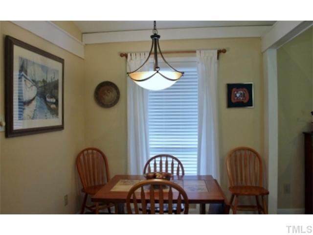5412 Round Hill Lane Raleigh, NC 27616 - Photo 8 of 19 a view of a dining room with furniture and wooden floor