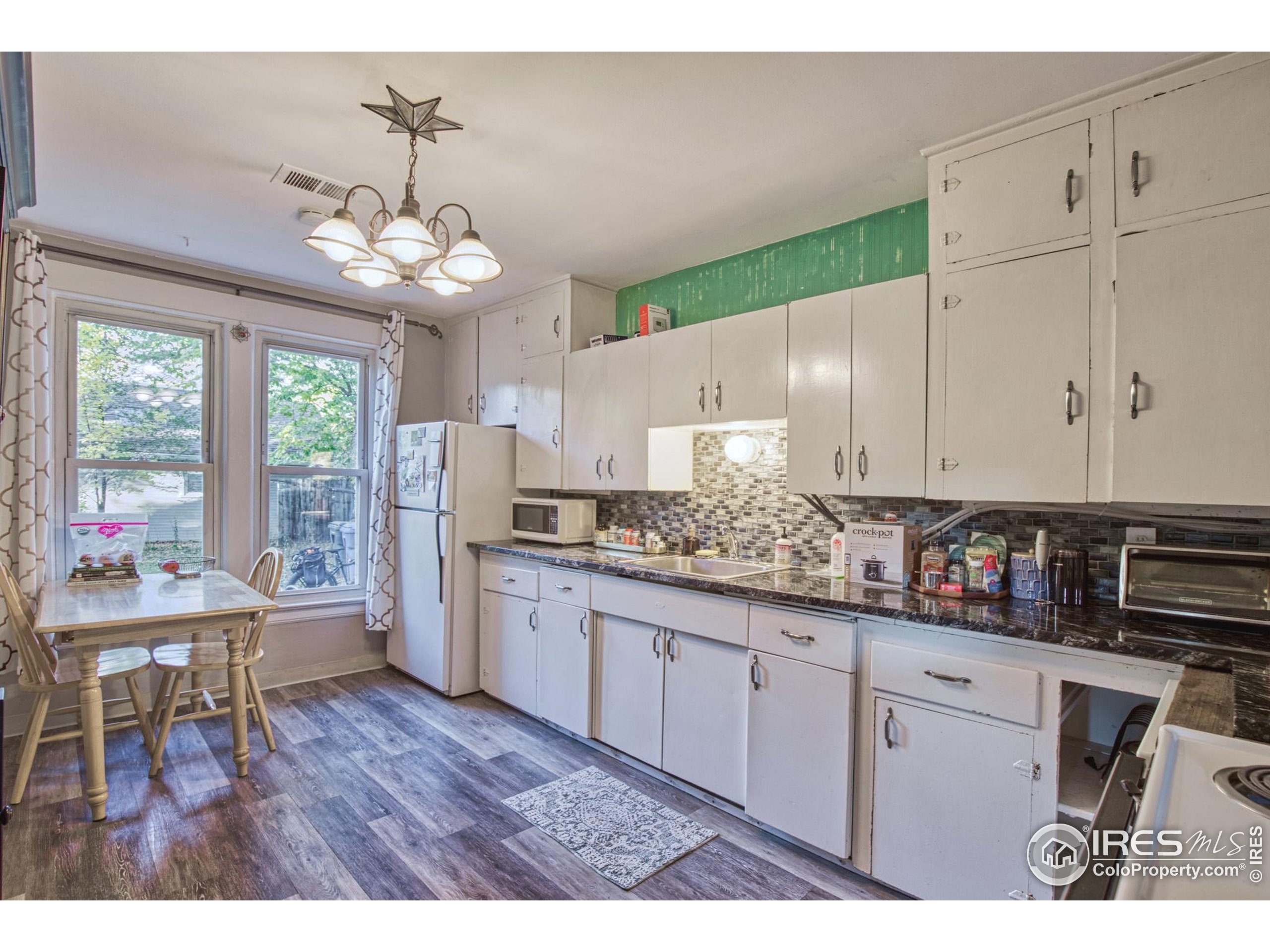530 Mathews Street Fort Collins, CO 80524 - Photo 11 of 34 a view of a kitchen and dining room
