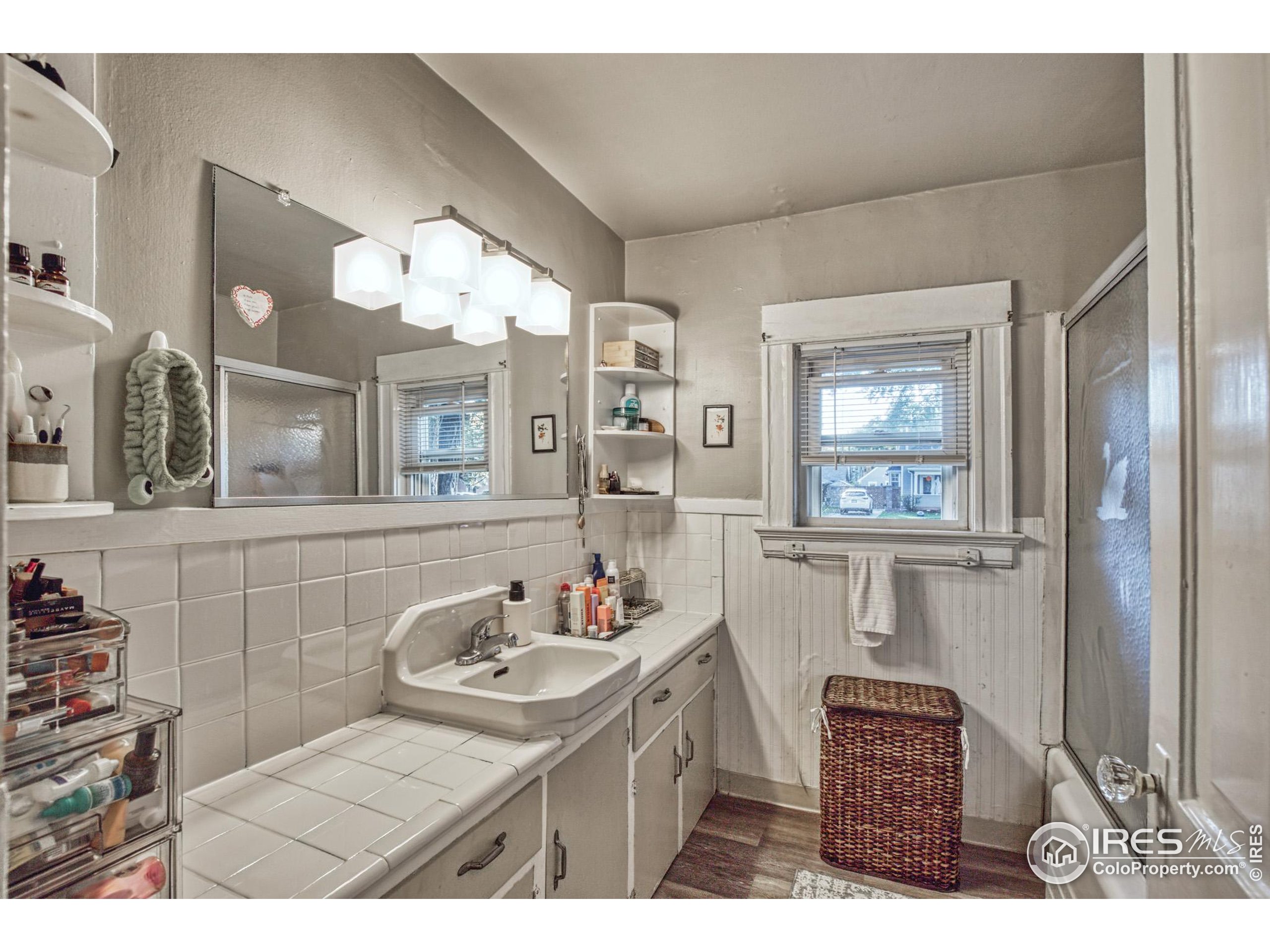 530 Mathews Street Fort Collins, CO 80524 - Photo 15 of 34 a bathroom with a sink vanity and a mirror