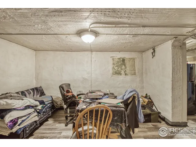 a bedroom with a bed and a table