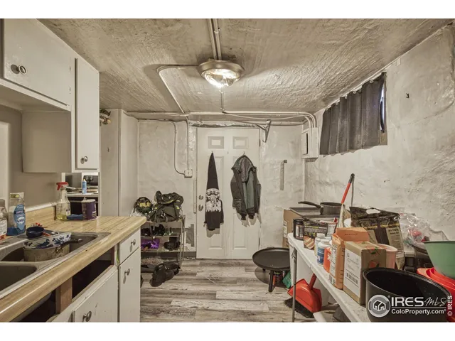 a kitchen with refrigerator and cabinets