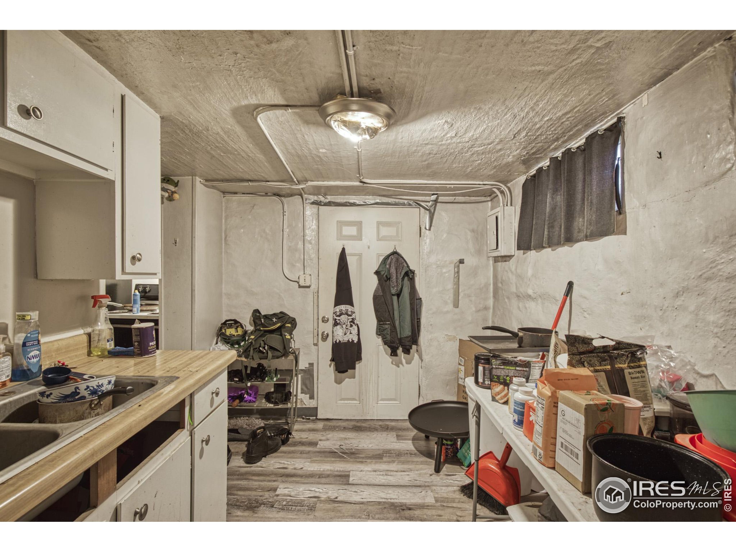 530 Mathews Street Fort Collins, CO 80524 - Photo 24 of 34 a kitchen with refrigerator and cabinets