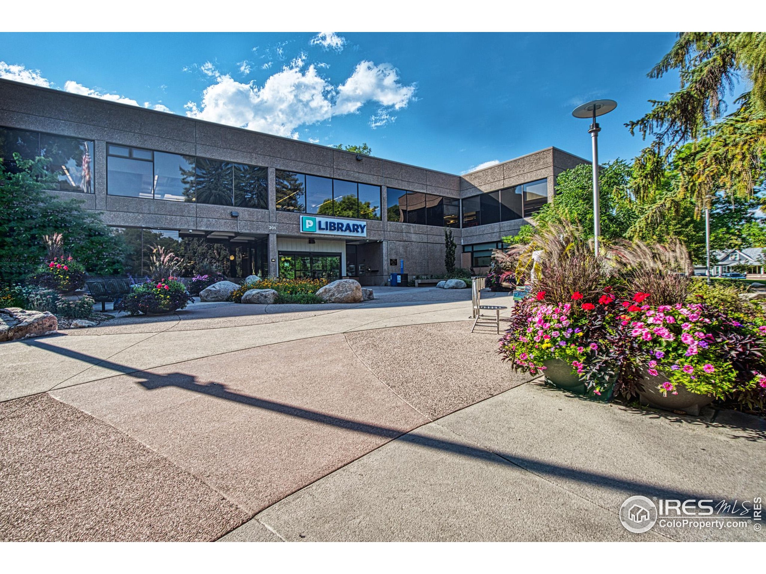 530 Mathews Street Fort Collins, CO 80524 - Photo 25 of 34 a building with potted plants in front of it