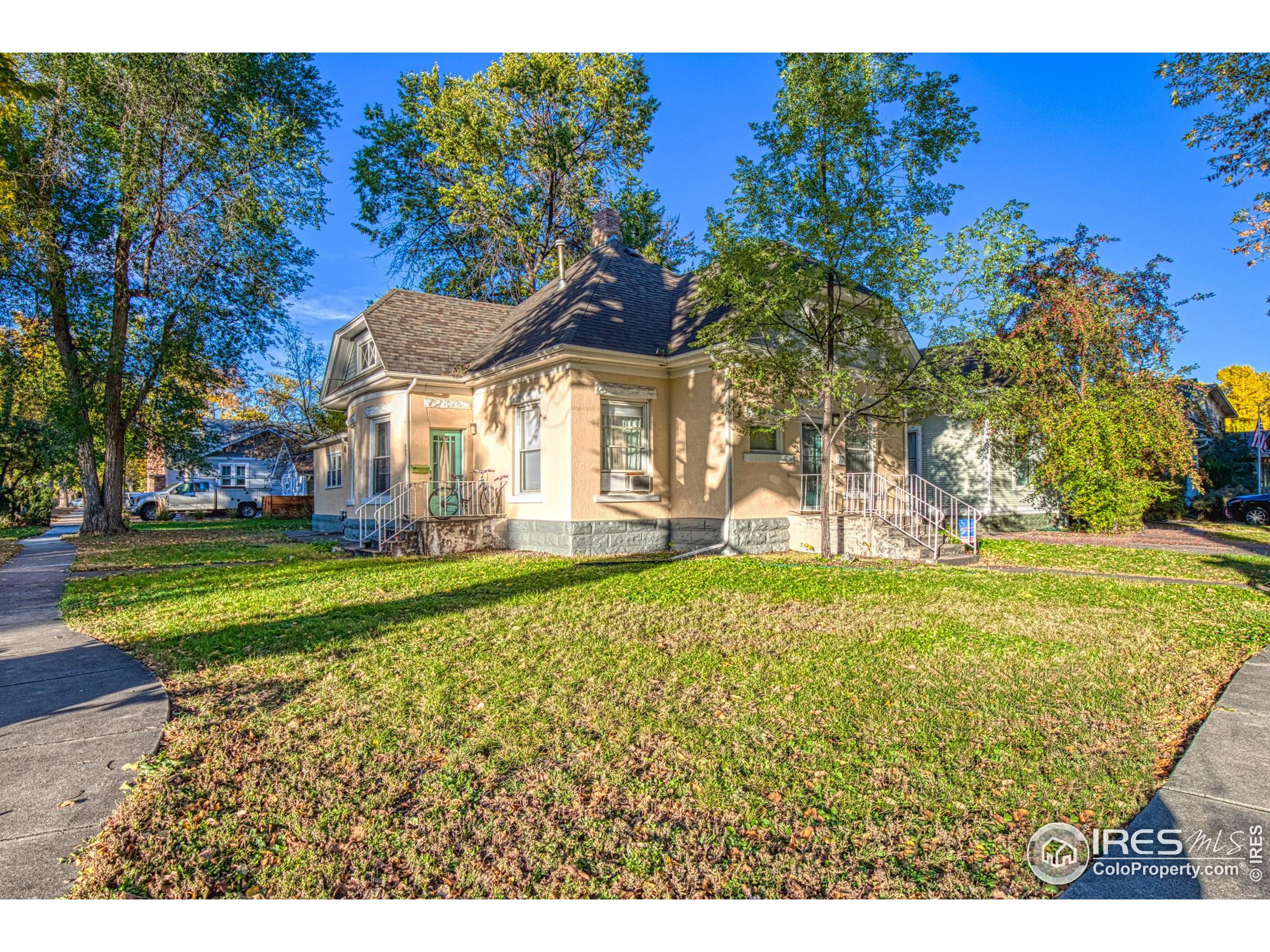 530 Mathews Street Fort Collins, CO 80524 - Photo 3 of 34 a view of a house with a backyard