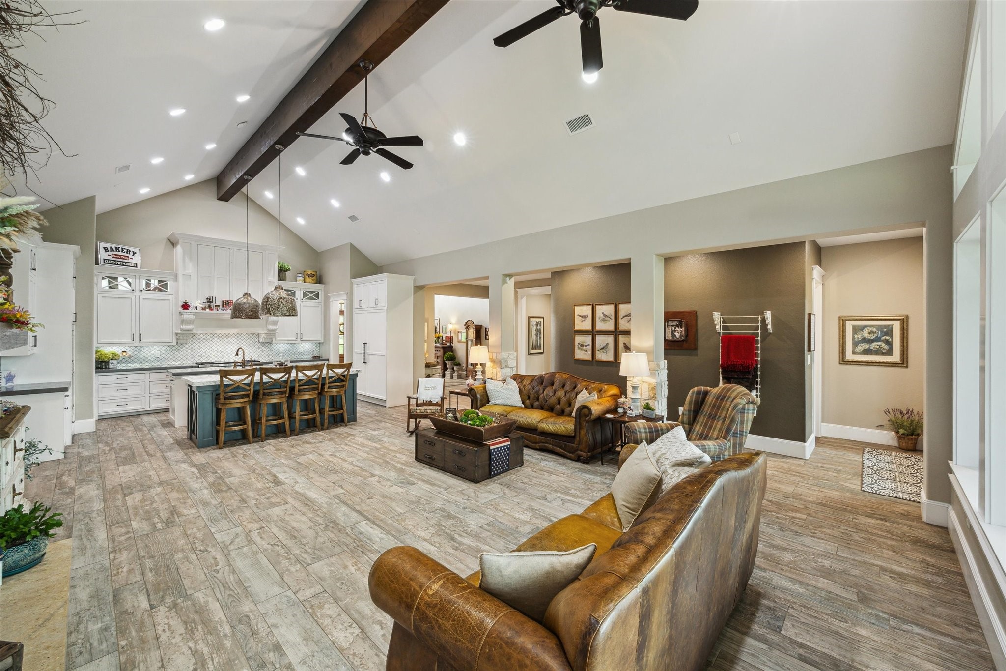 1255 Bronco Trail Angleton, TX 77515 - Photo 13 of 50 The living room is thoughtfully designed with two ceiling fans, recessed lighting, and a custom lighting system that allows you to create various ambiance scenes. This system can be easily controlled from your smartphone, offering both convenience and versatility in setting the perfect mood.
