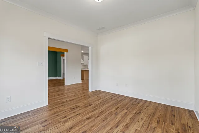 a kitchen with a sink and a chandelier