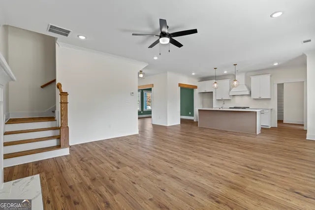 a white toilet sitting next to a white wall