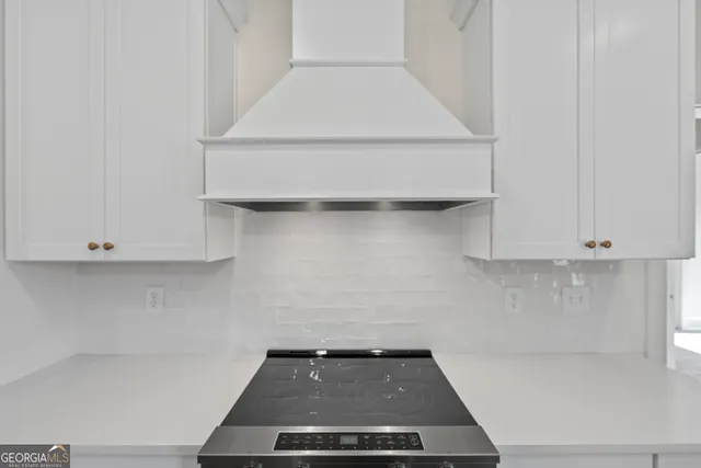 a white bath tub sitting next to a shower