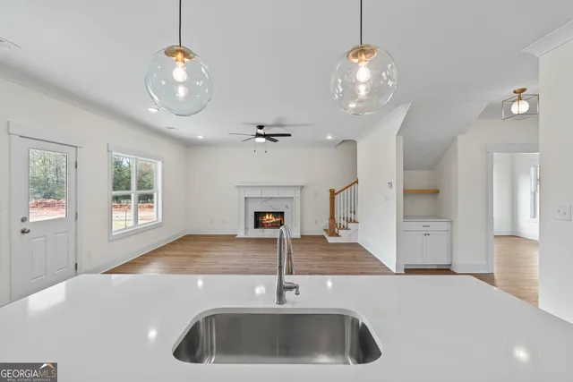 a white bath tub sitting in a bathroom next to a window